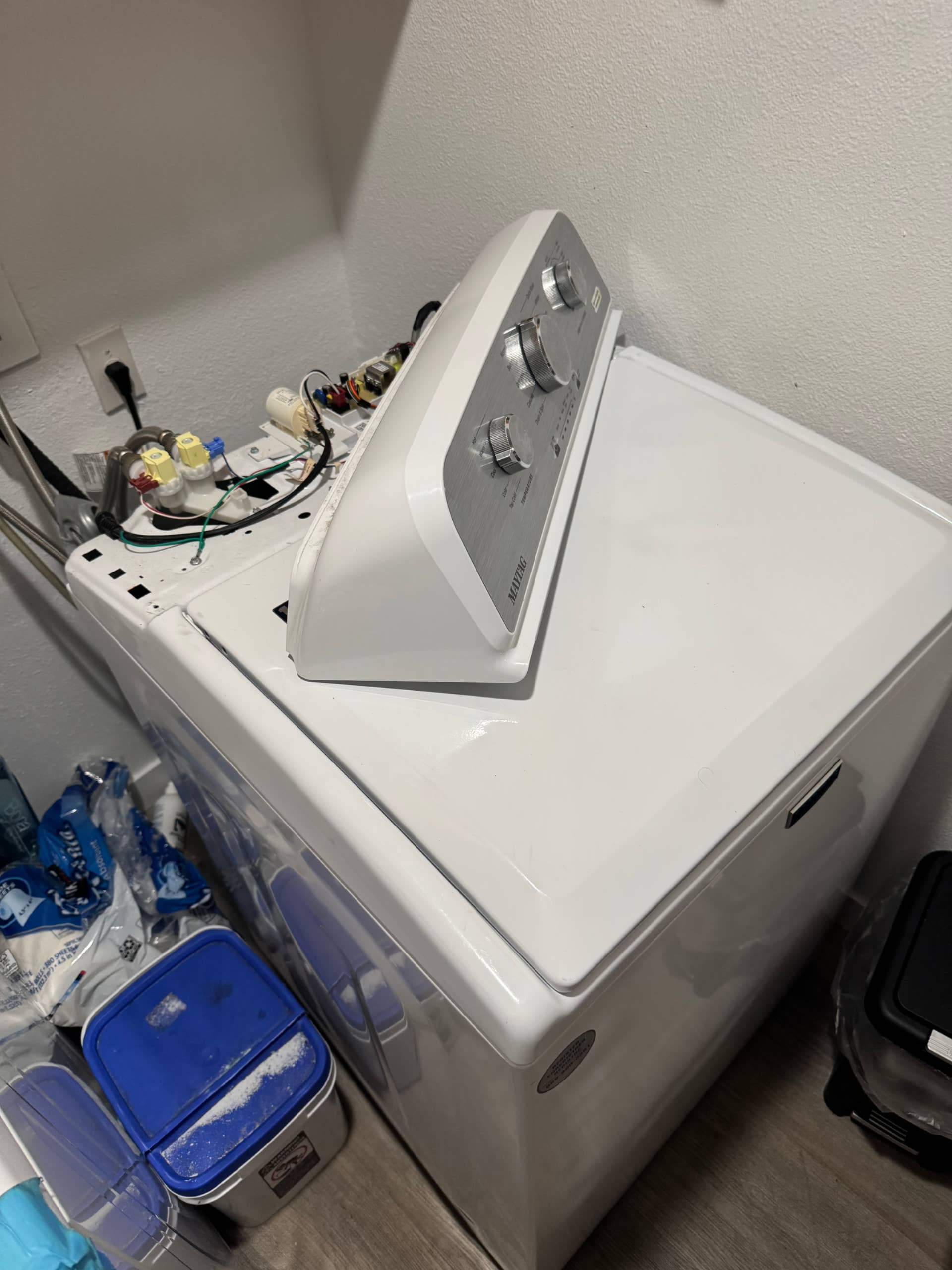 Maytag top-load washer with control panel removed during inlet valve repair in Portland