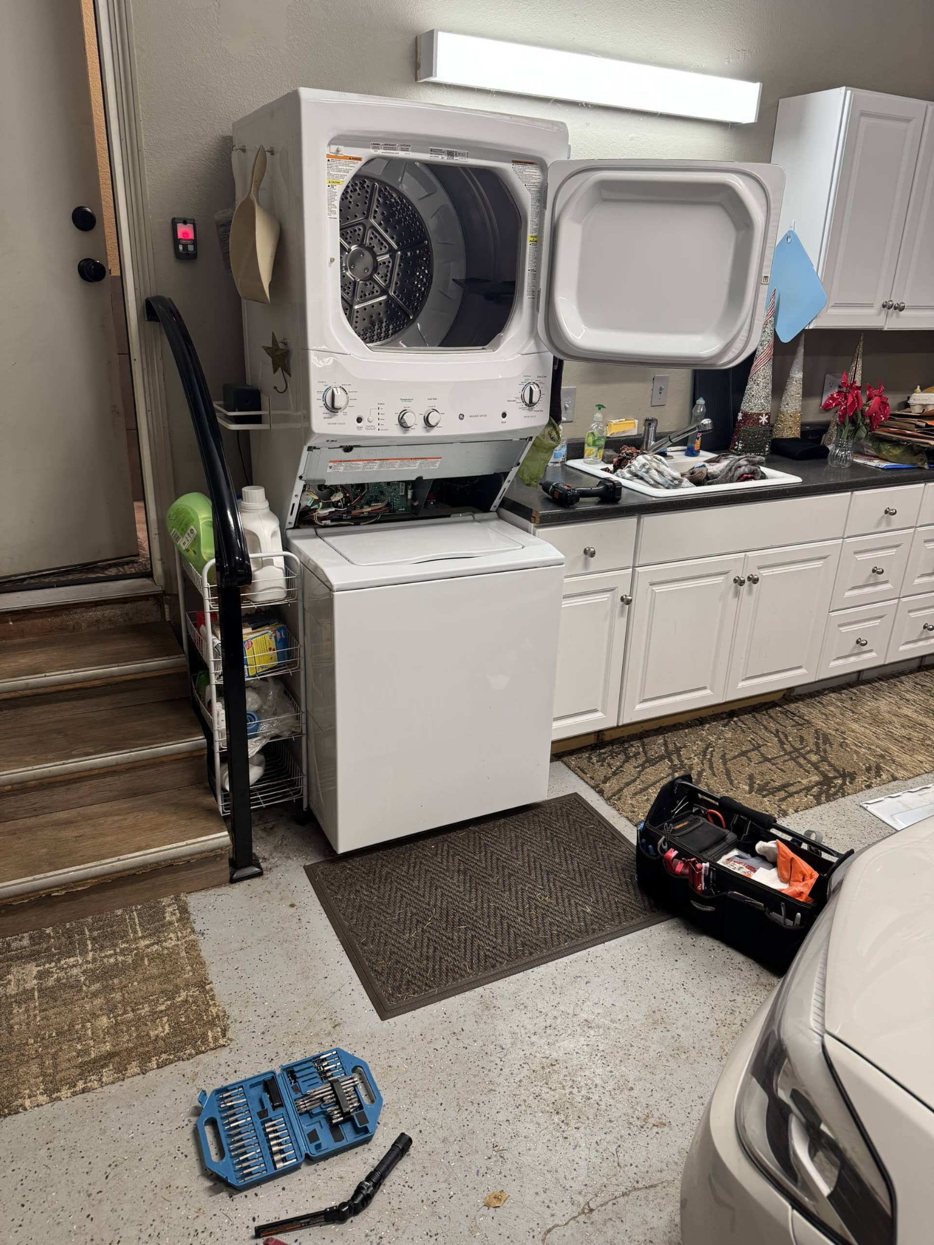 GE stackable washer repair in progress – washer not draining issue in Oregon City OR 97045