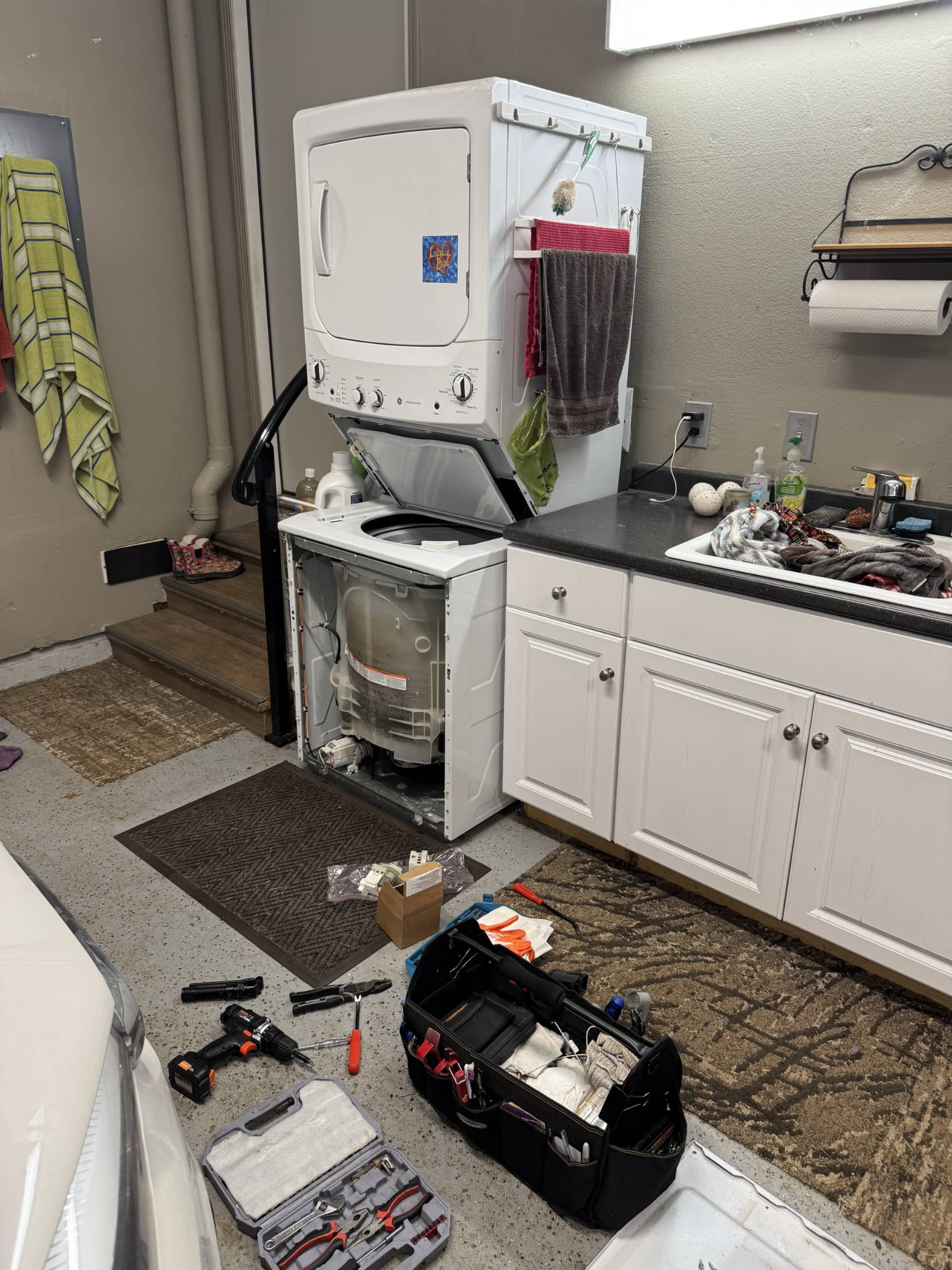 GE stackable washer opened for drain pump replacement in Oregon City OR 97045