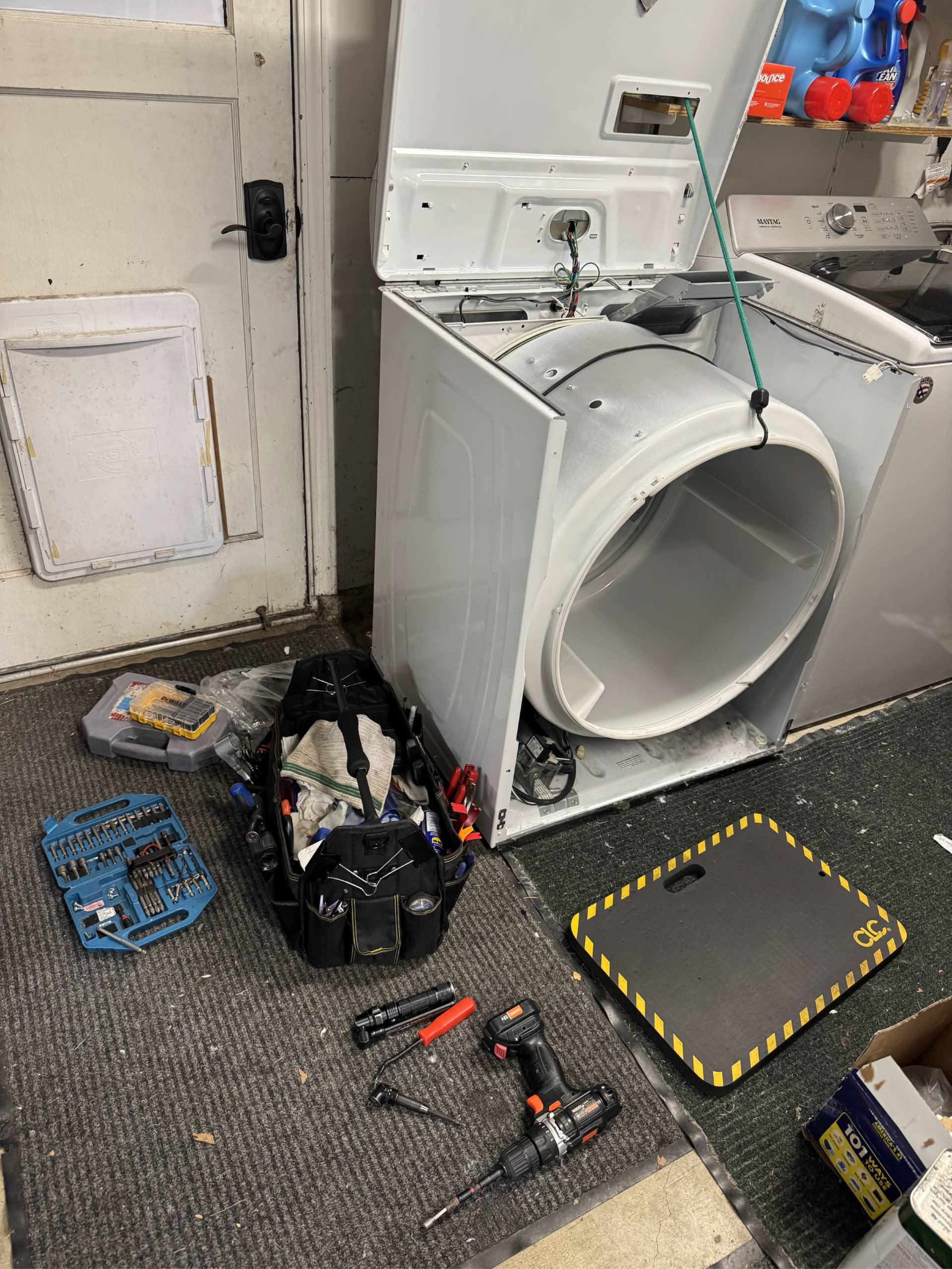 Maytag dryer disassembled showing drum removed for repair