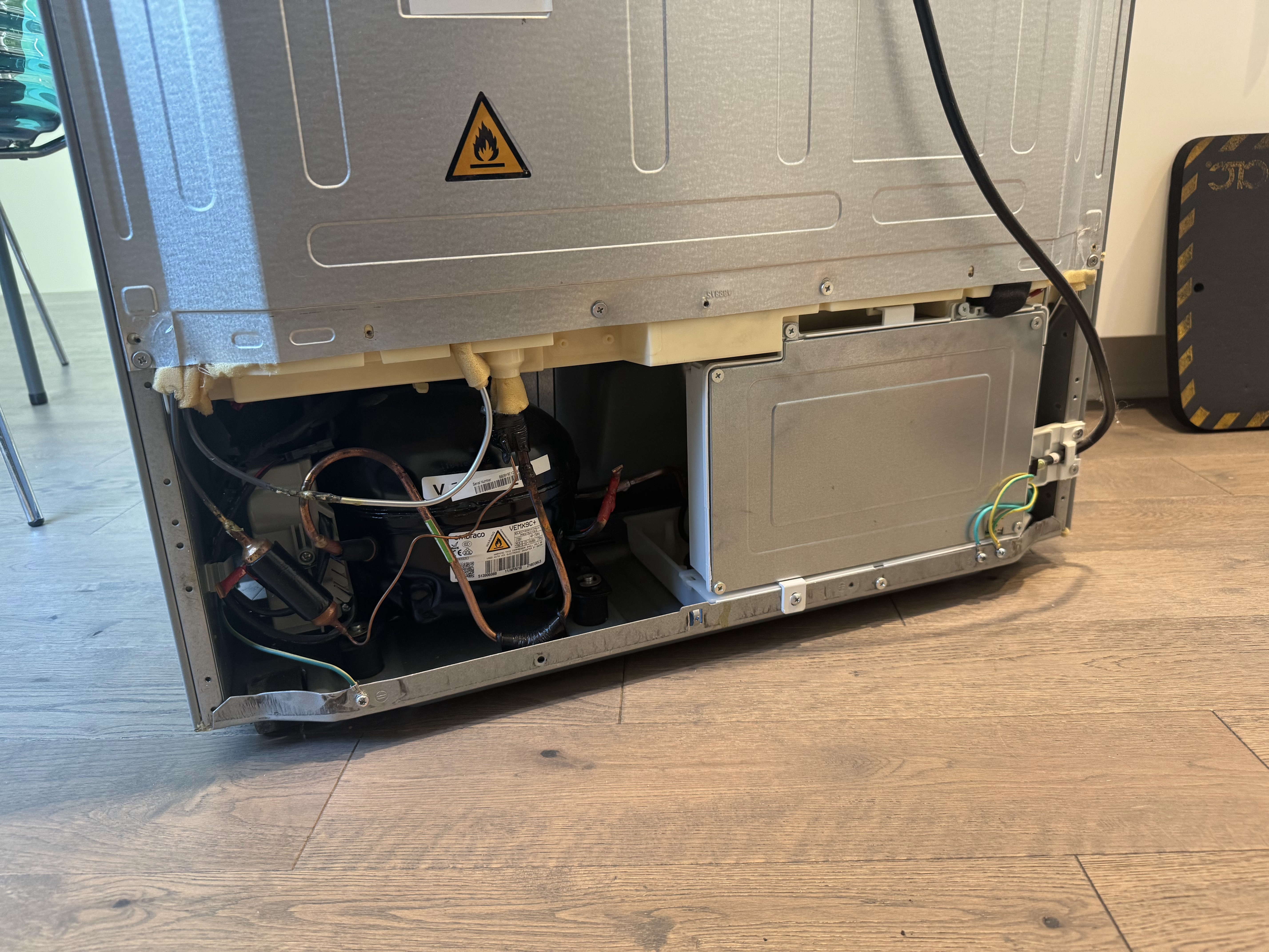 Haier refrigerator rear compartment accessed during drain line maintenance in Portland, OR 97213