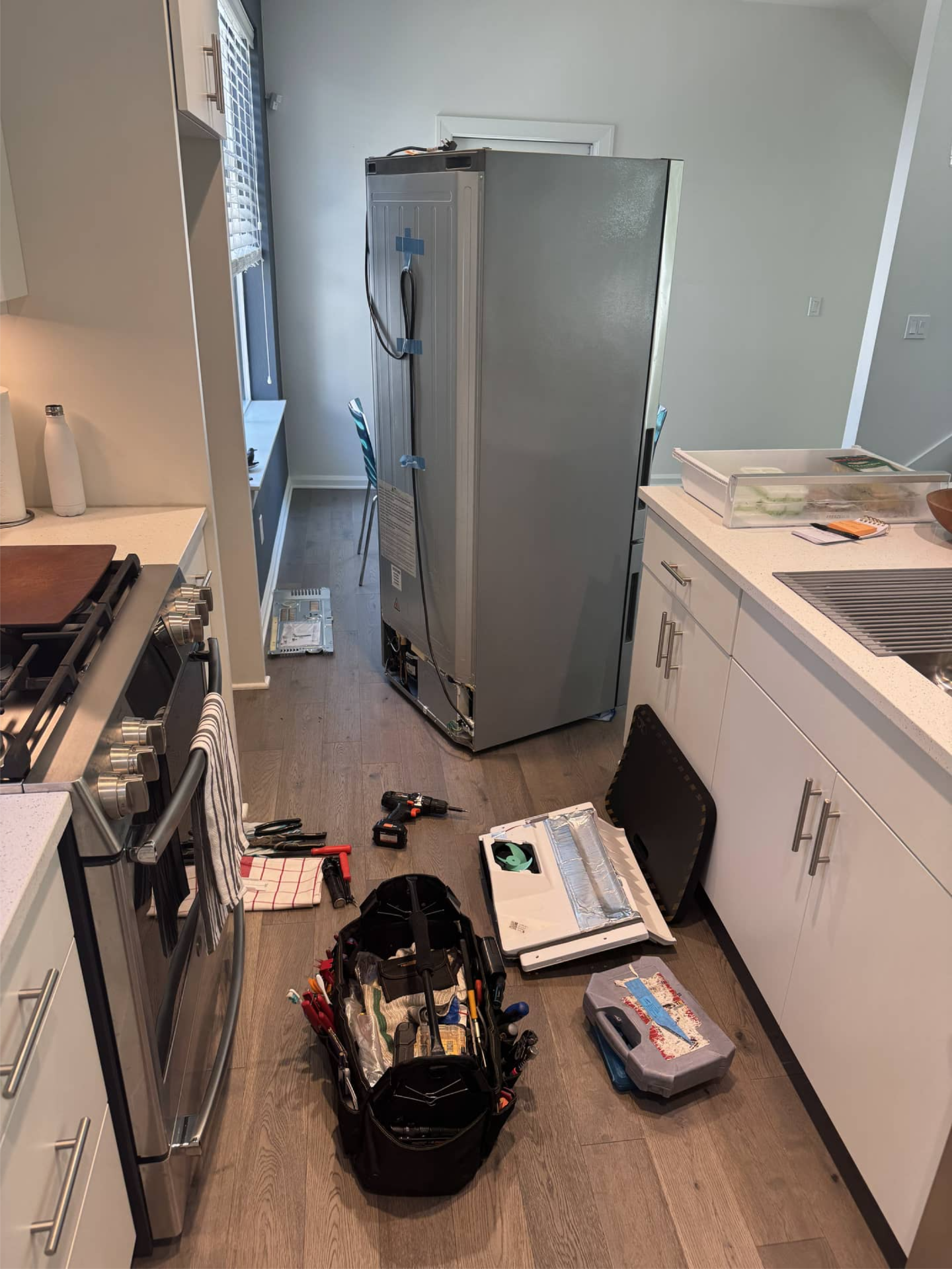 Haier refrigerator pulled out for drain line maintenance in Portland, OR 97213