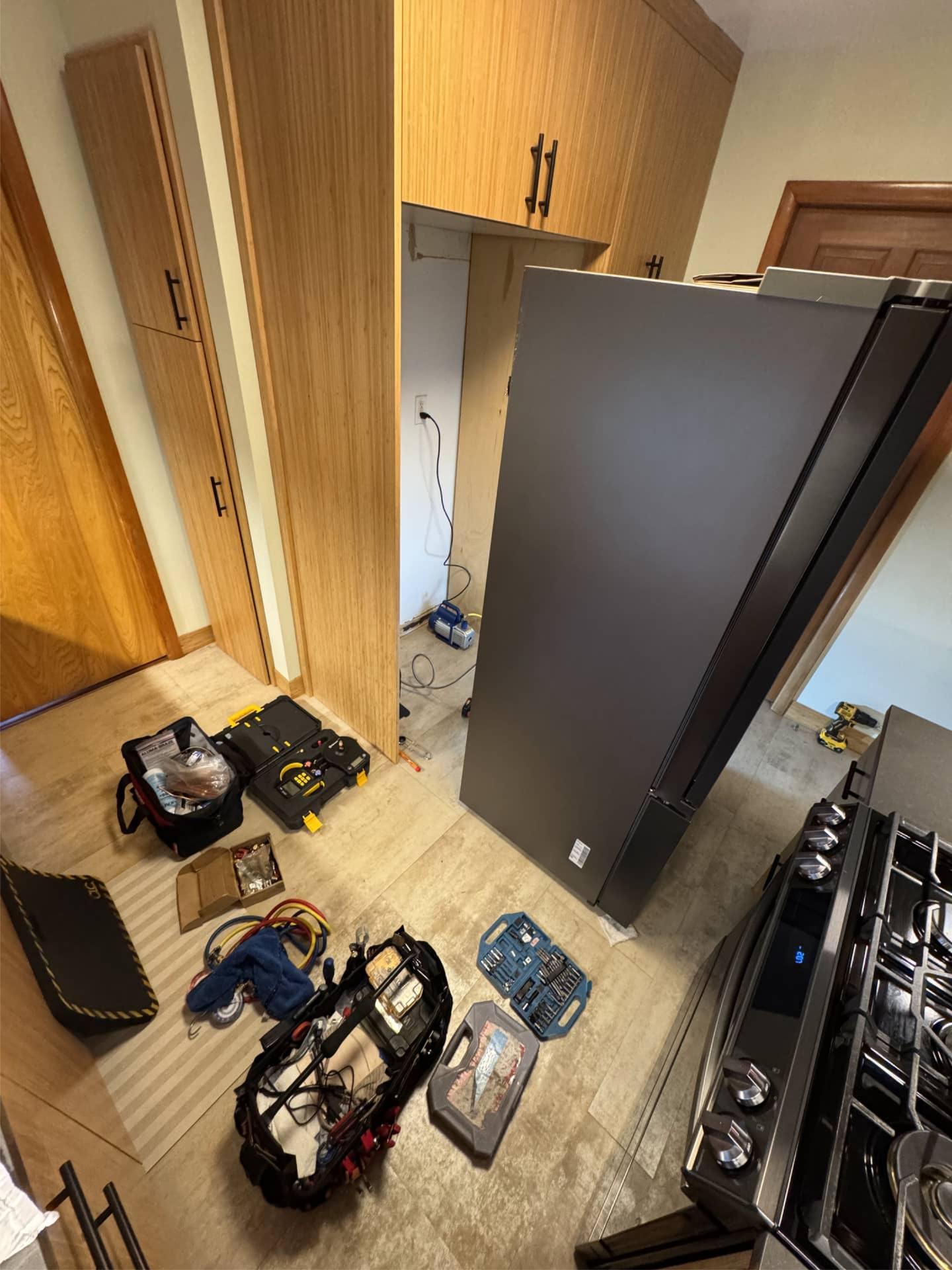 Samsung refrigerator pulled out for compressor replacement in Portland, OR 97206