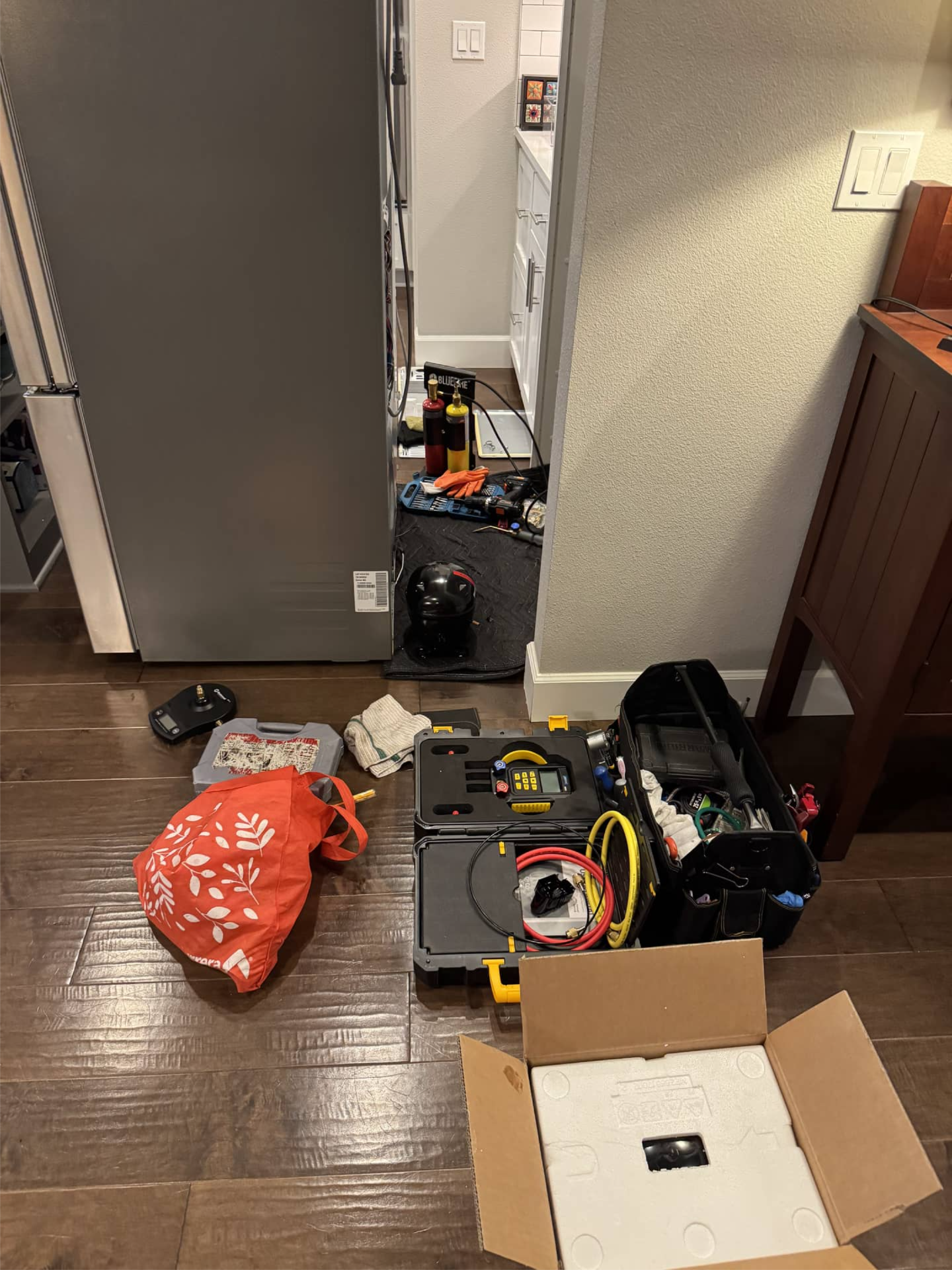 LG refrigerator pulled out for compressor replacement in Happy Valley, OR 97086