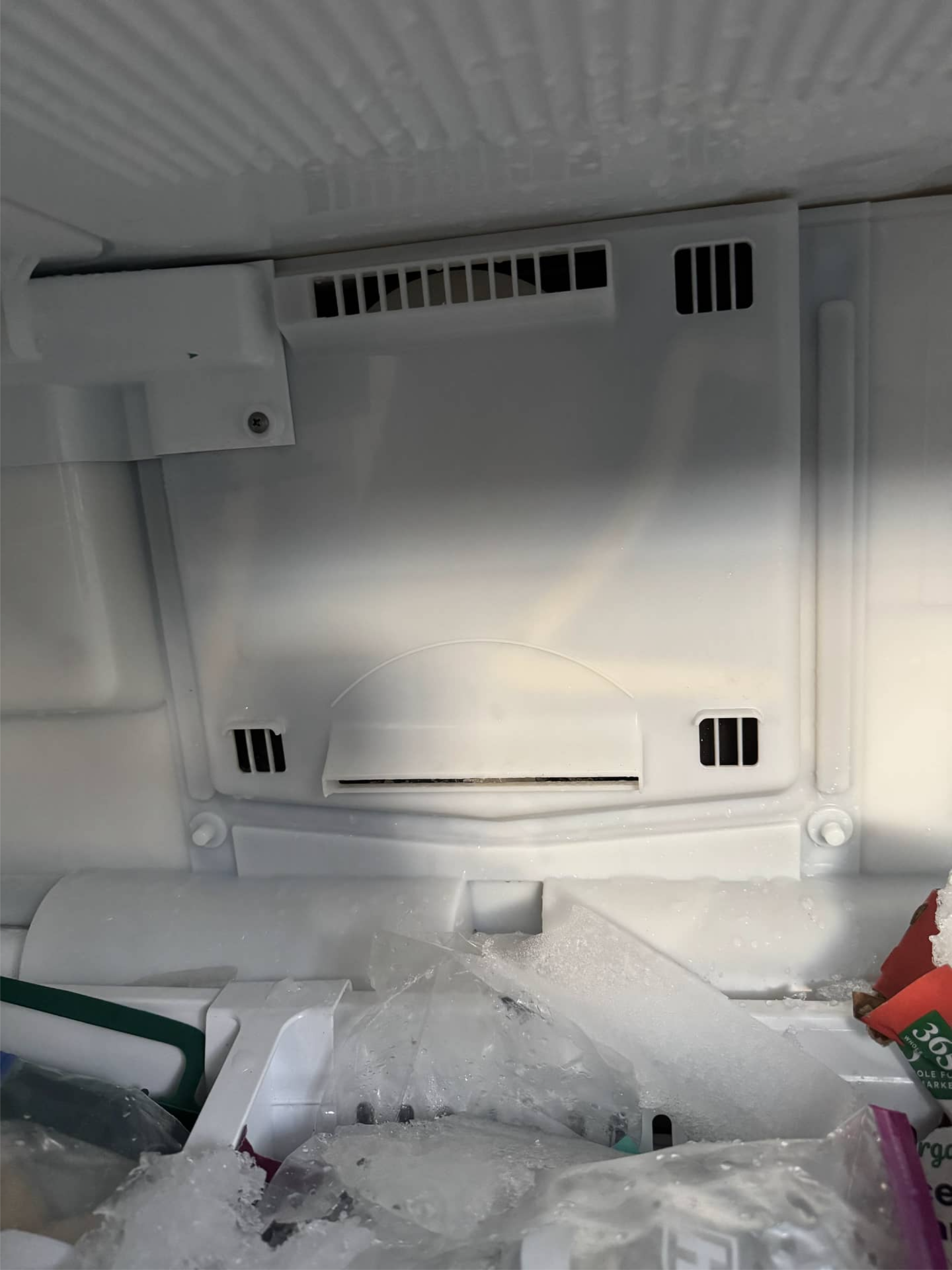LG refrigerator freezer compartment with heavy ice buildup in Portland, OR 97212