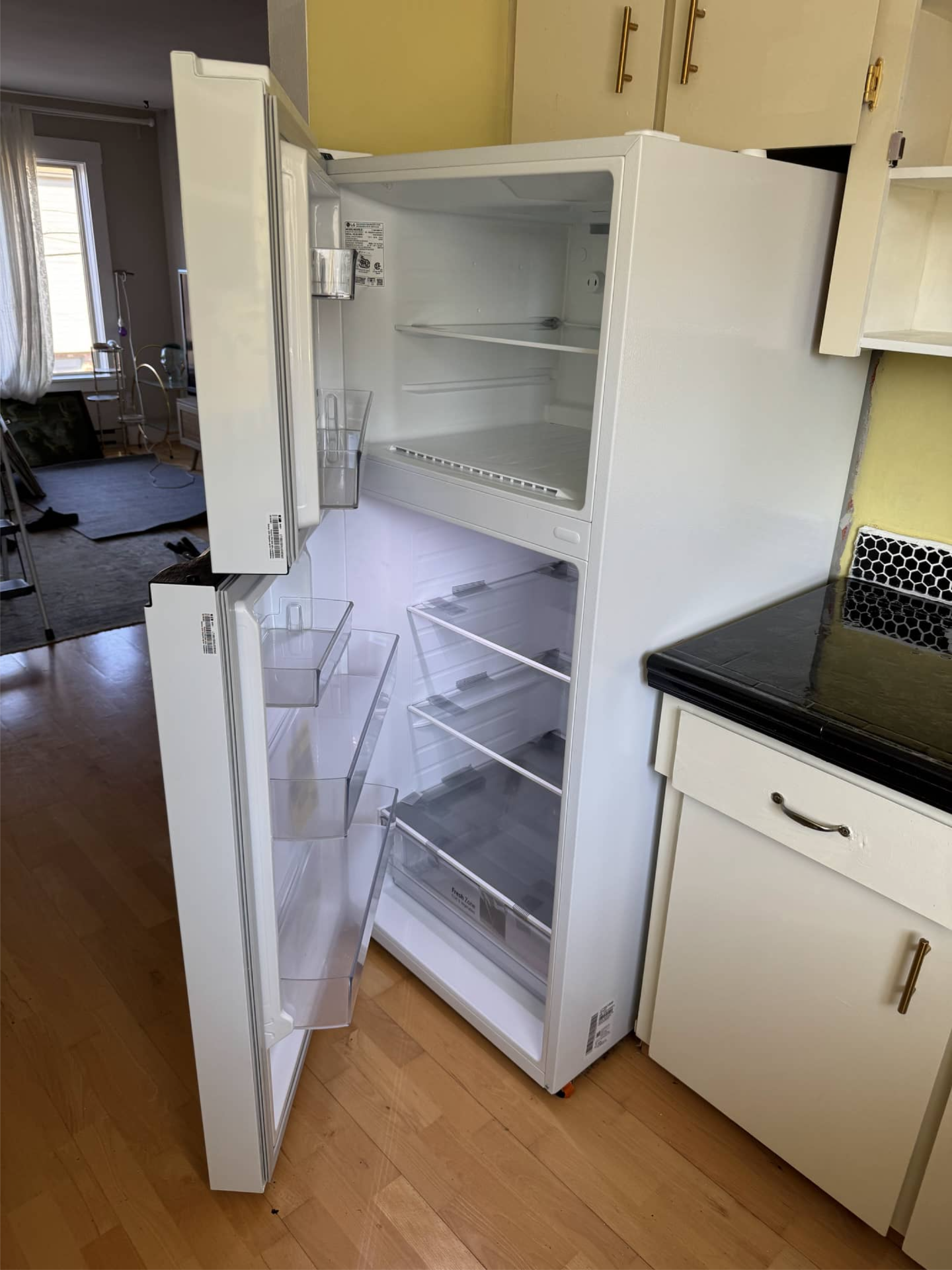 LG refrigerator with doors open before changing door opening side in Portland, OR 97214
