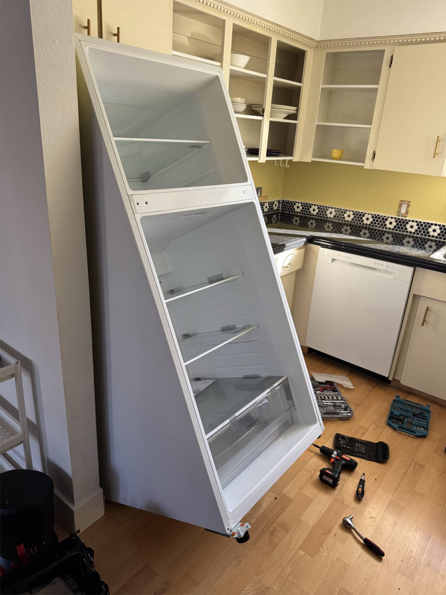 LG refrigerator with doors removed for door opening side conversion in Portland, OR 97214