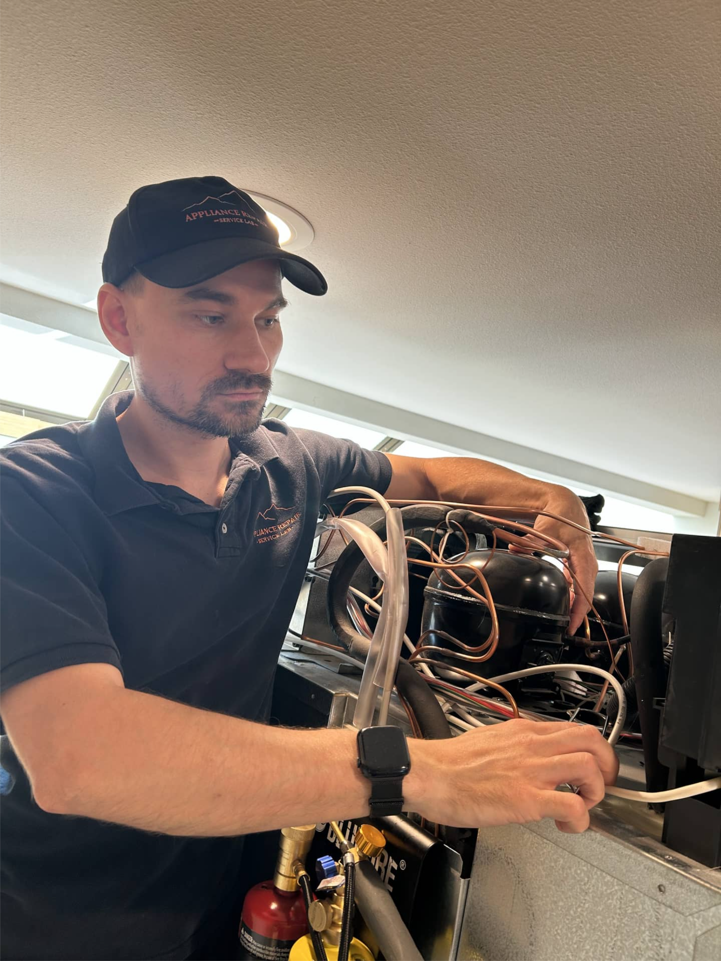 Technician replacing Sub-Zero refrigerator compressor in Portland, OR 97239
