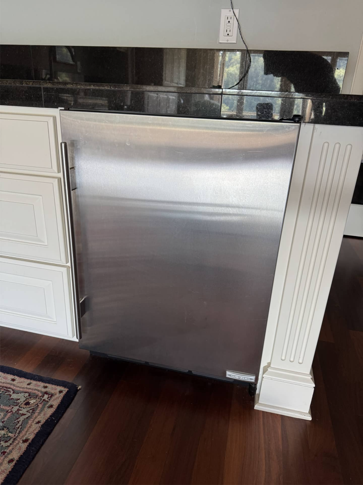 Technician replacing Sub-Zero refrigerator compressor in Portland, OR 97239