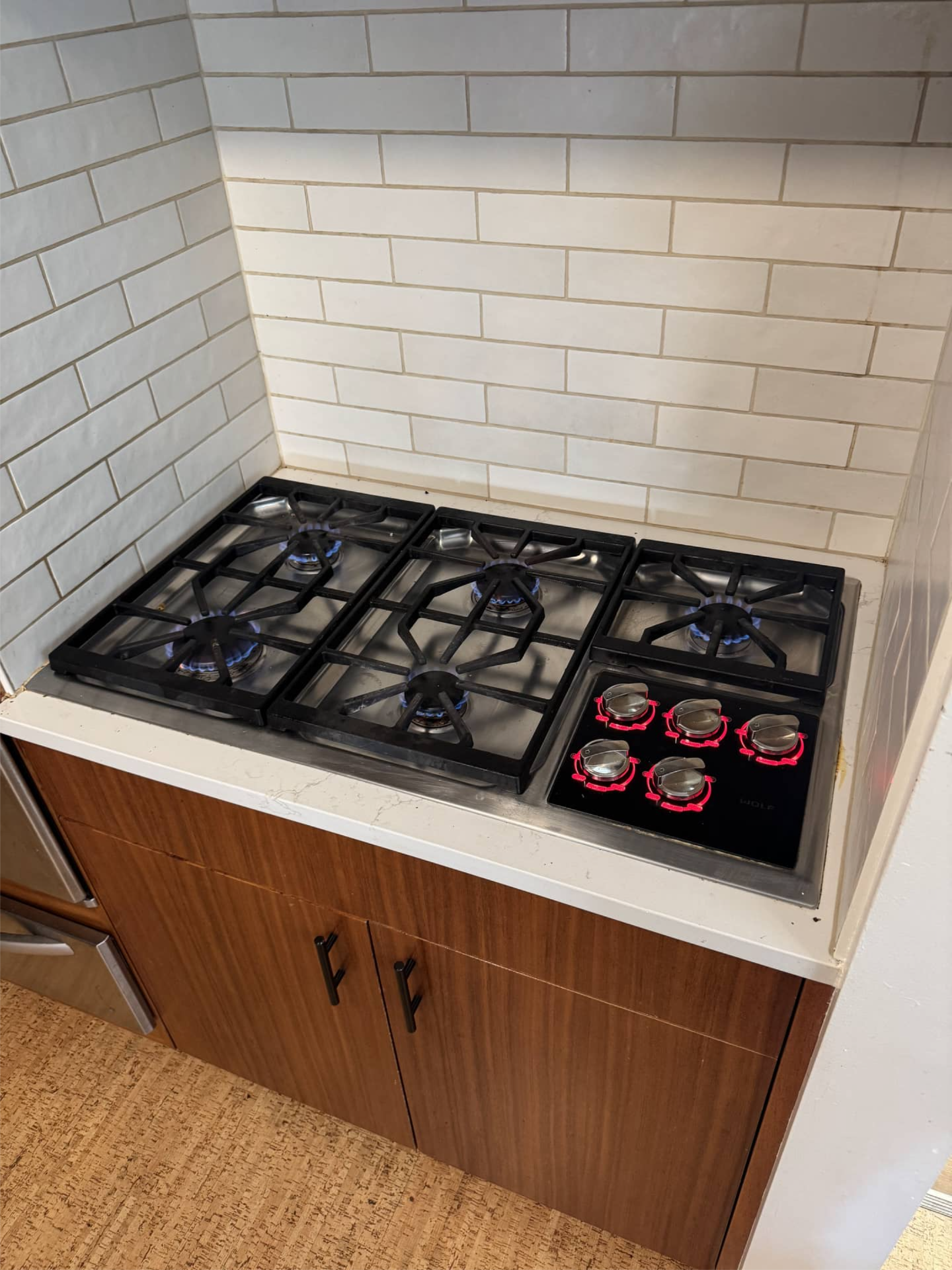 Wolf gas cooktop with burners working after gas valve repair in Portland, OR 97211
