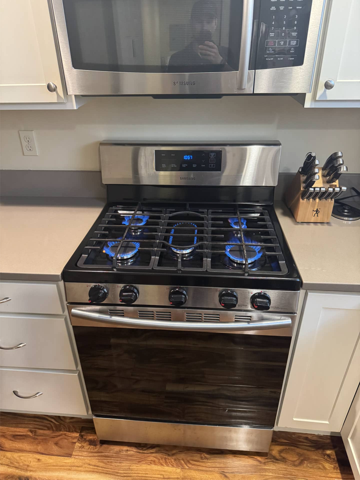 Samsung gas range tested after repair with all burners operating in Portland, OR 97214
